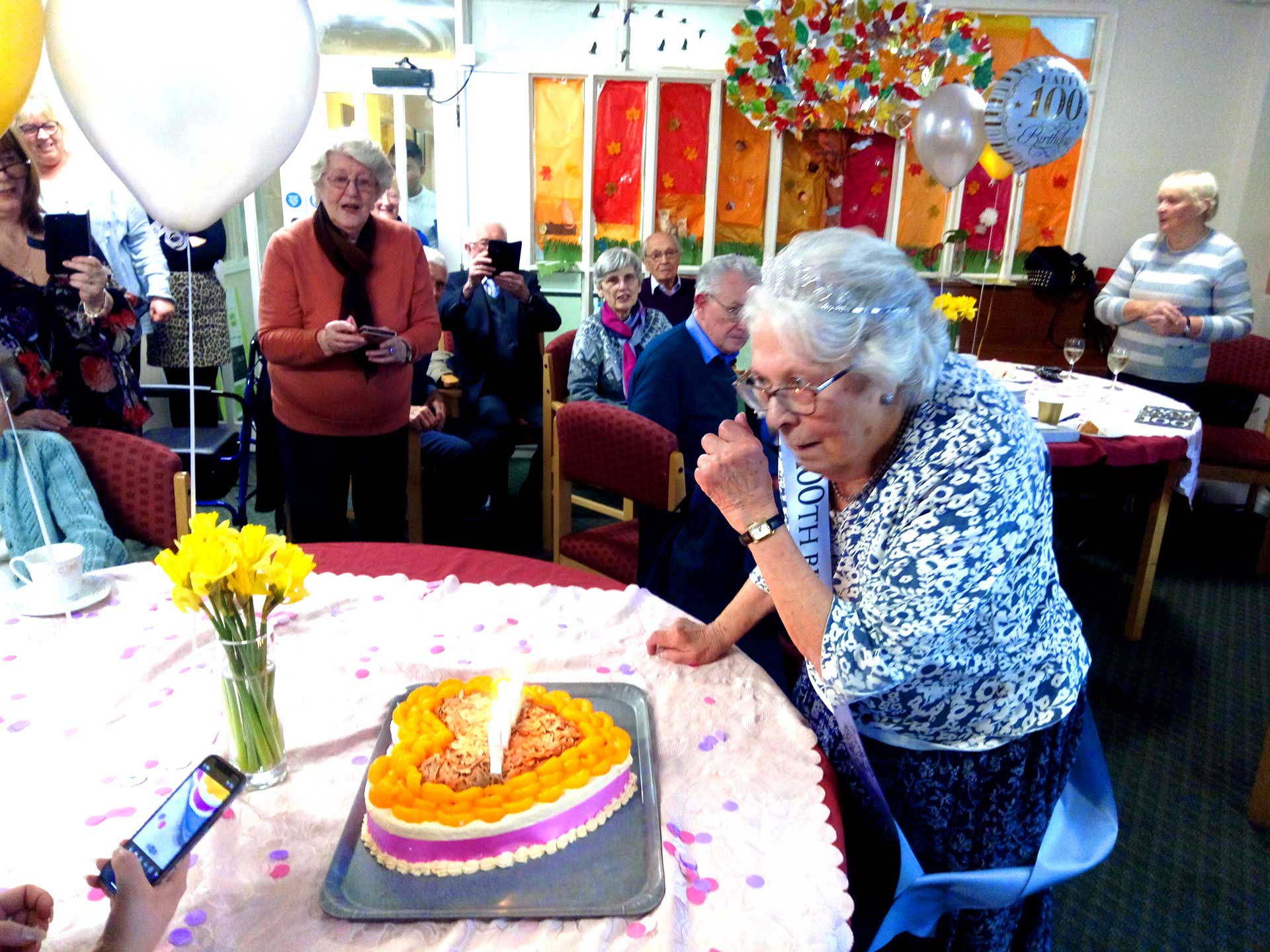 Marie preparing to blow out candles